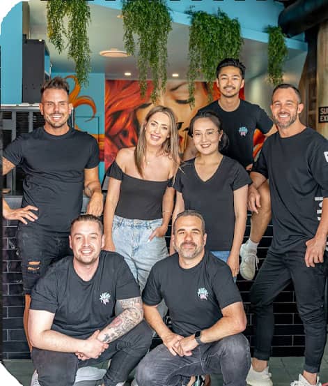 7 people smiling in front of the camera in a Milky Lane restaurant bar